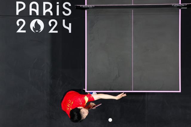 樊振东扛着压力笑到最后 巴黎夺金成就男单大满贯